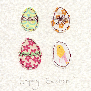 four stitched fabric eggs handmade card