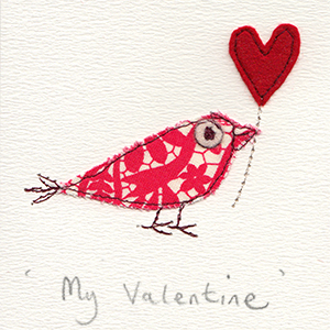 red and white patterned paper bird with red felt heart balloon handmade card