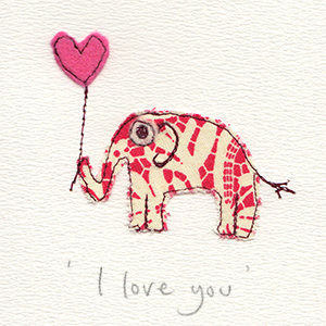 red and white patterned paper stitched elephant with pink felt heart balloon